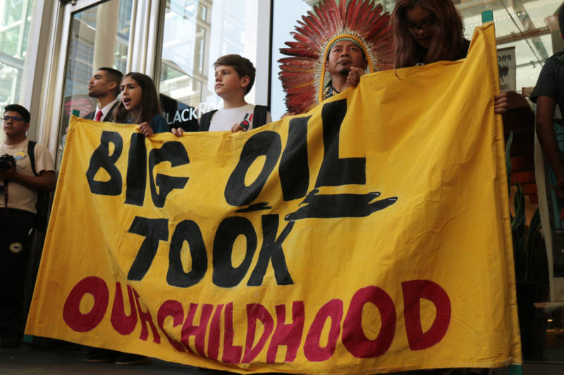 Youth stand with indigenous activists in front of the San Francisco offices of BlackRock, Inc., during a youth-led climate march on Sept. 20, 2019.