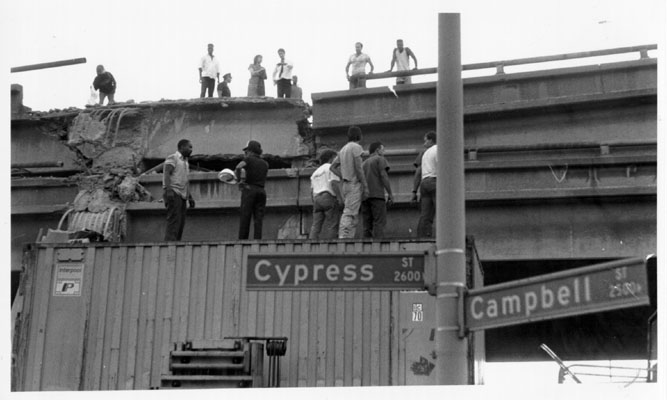 Residents and rescue workers on the Cypress freeway.