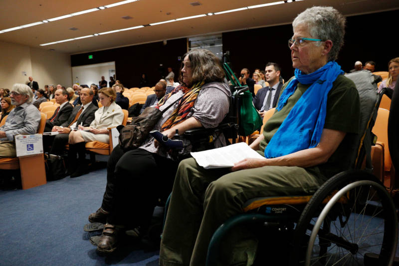Deborah Kaplan (left) of Oakland and Marge Hall (right) of Berkeley waited 3.5 hours to speak during the public comment portion of Friday's CPUC meeting in San Francisco.