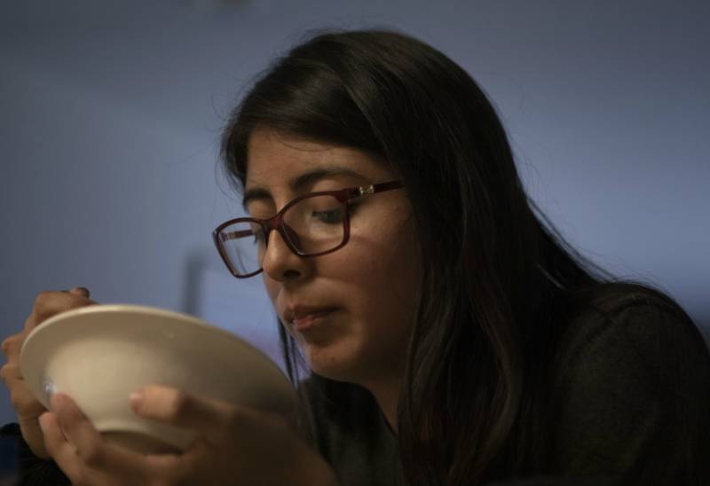 Photo of Beverly Callupe eating soup.
