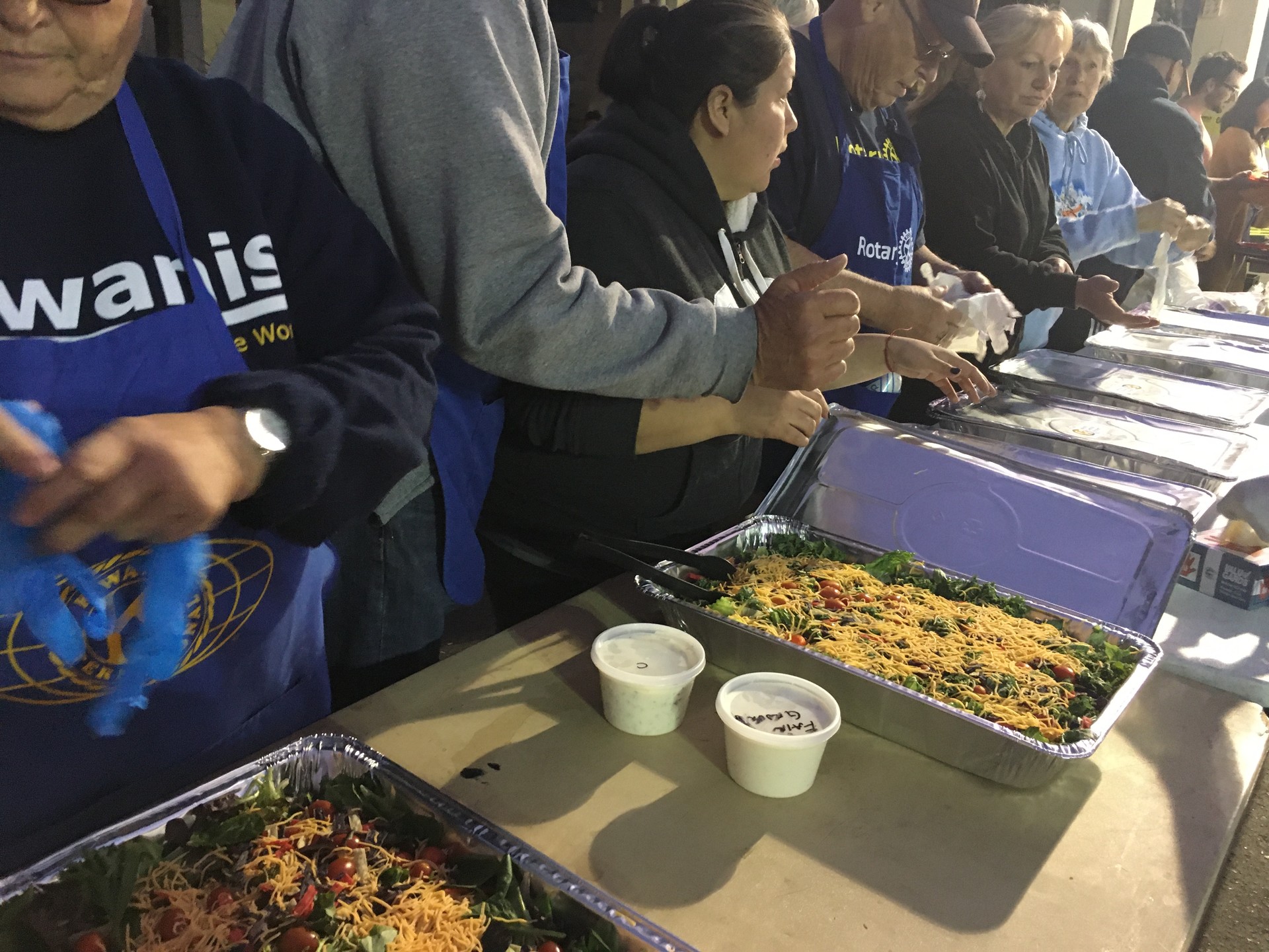 Members of the local for Kiwanis International volunteered to serve dinner for World Central Kitchen at the Cloverdale Citrus Fairgrounds as the Kincade Fire raged in Sonoma County.