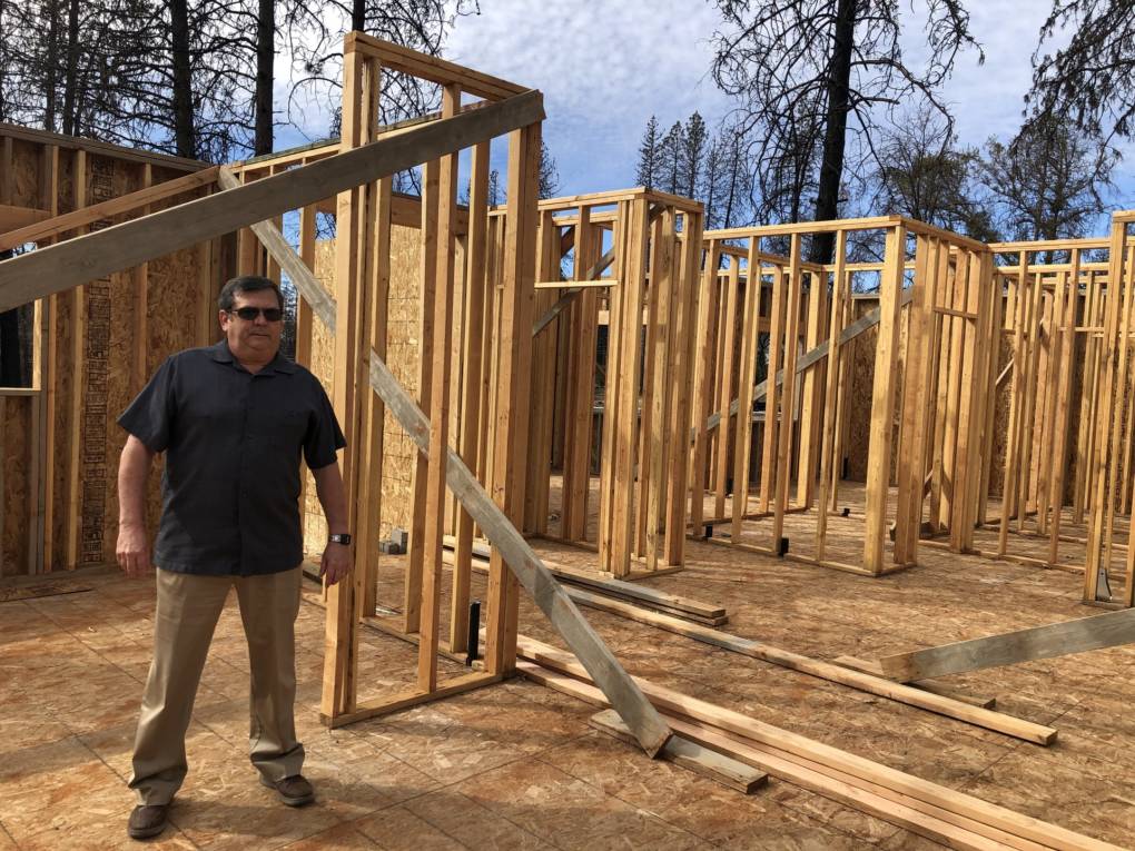 Bill Sharrett stands in the living space of his new home in Paradise. He lost the home that used to stand here in the Camp Fire. 