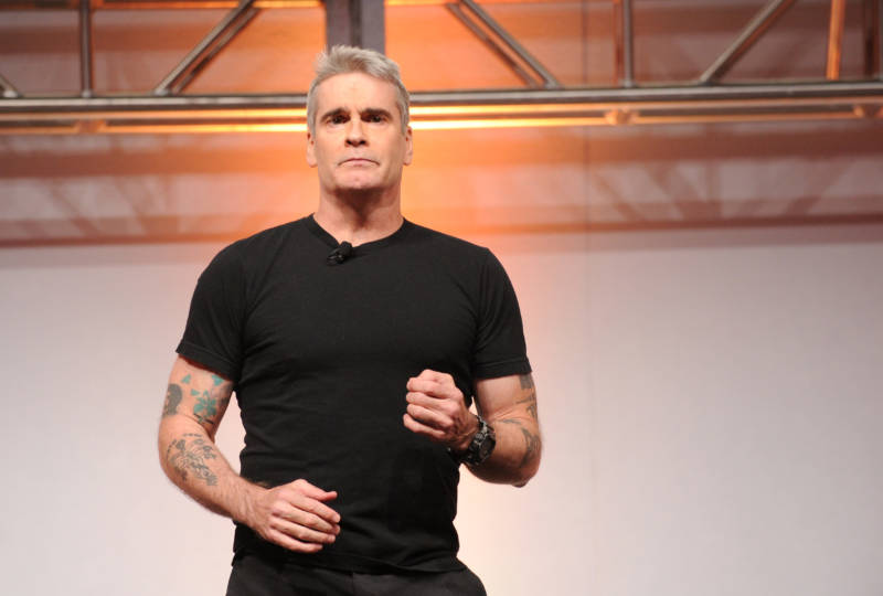 Look how much better Henry Rollins looks in a black t-shirt and pants, compared to his naked performance below. If all else fails, go for black jeans and a t-shirt, any time.