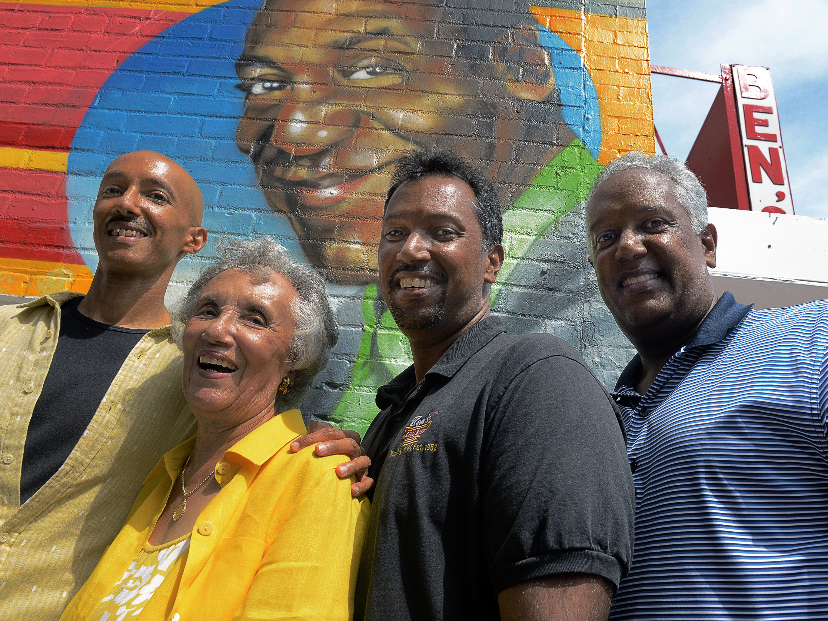 Virginia Ali, matriarch of the Ali family, of Ben's Chili Bowl, with her sons Sage (from left), Nizam and Kamal on the eve of their 55th-anniversary celebration, Aug. 21, 2013.