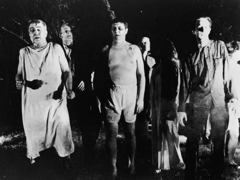 A line of zombies in a still from 'Night Of The Living Dead,' directed by George Romero, 1968. The film has been reissued for screenings on the 50th anniversary of its release.