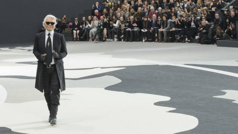 Lagerfeld acknowledges applause following a Chanel show in Paris in 2013.