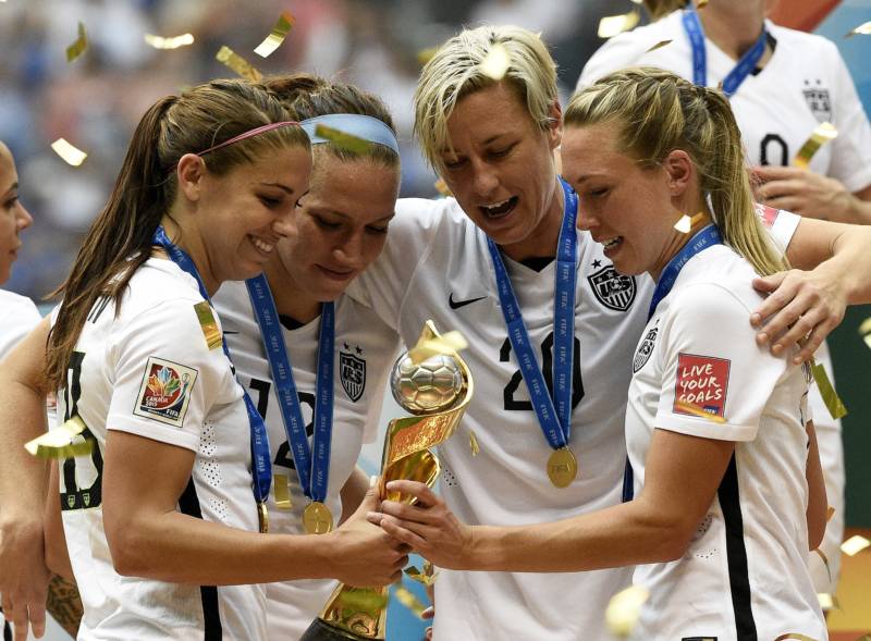 (L-R) Alex Morgan, Lauren Holiday, Abby Wambach and Whitney Engen celebrate after winning the final 2015 FIFA Women's World Cup match in Vancouver, July 5, 2015.