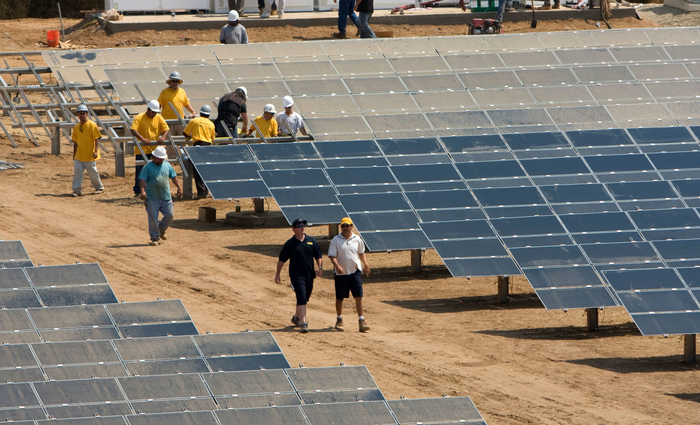 Workers install a solar farm outside Sacramento.