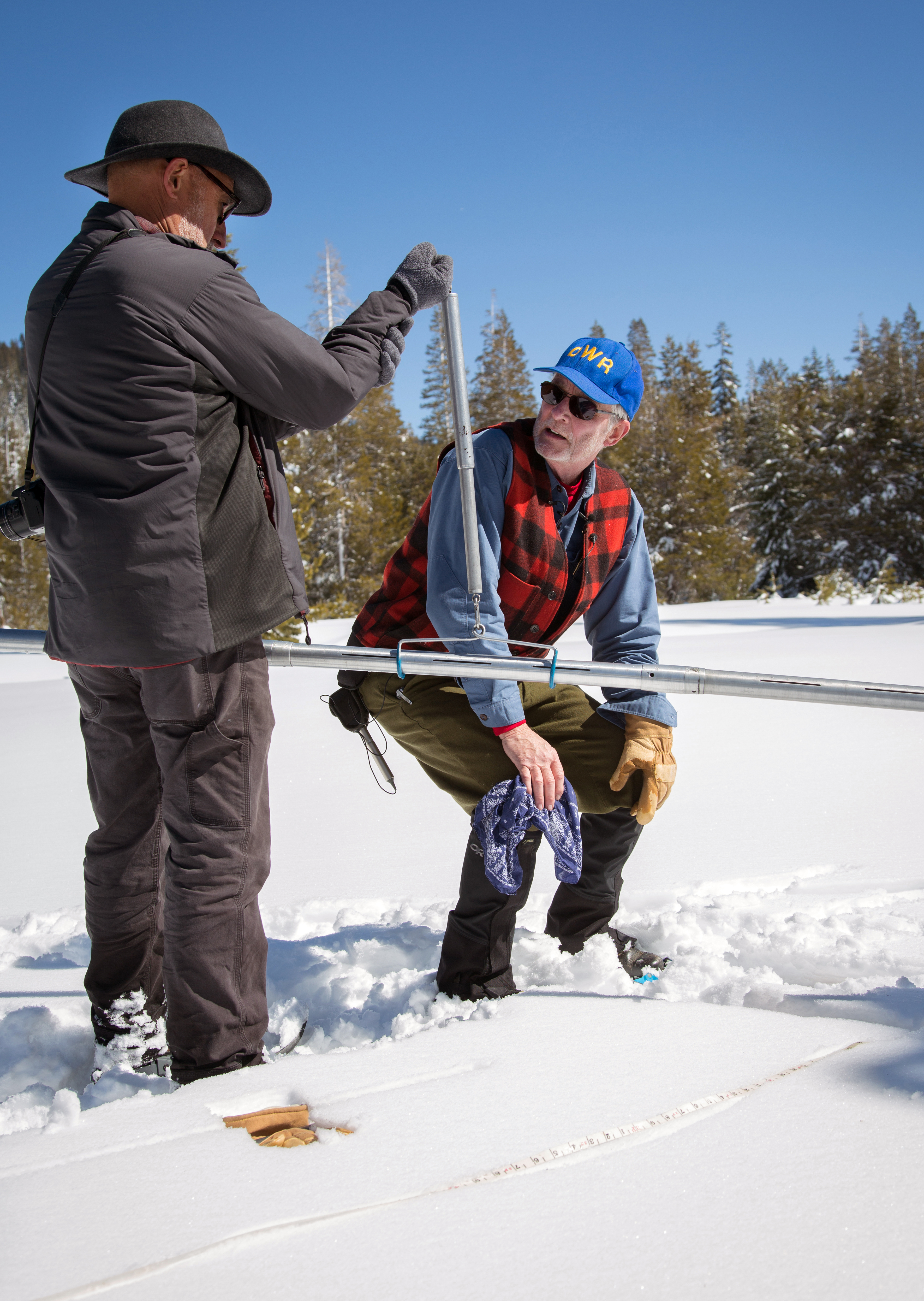Armando Quintero (Left). Chief for the California Water Commission, assists Frank Gehrke, Chief for the Calif. Cooperative Snow Surveys Program, with the third snow survey of the 2017 snow season. Photo taken March 1, 2017.