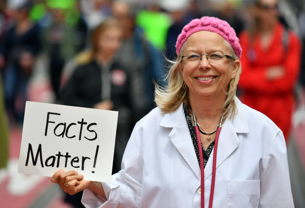 Liz Darner holds up a sign while participating in the March for Science in San Francisco.