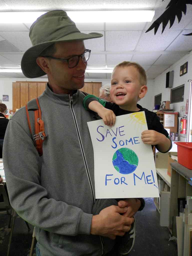 Hayes Morehouse and his two-year-old son Sylvan Morehouse at Hayward's Sun Gallery. The gallery hosted a poster-making session in anticipation of the city's upcoming March for Science.