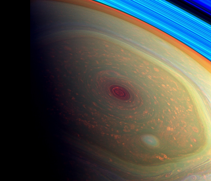 Saturn's pole is encircled by an enigmatic hexagonal cloud system, punctuated at the center by a circular "eye".