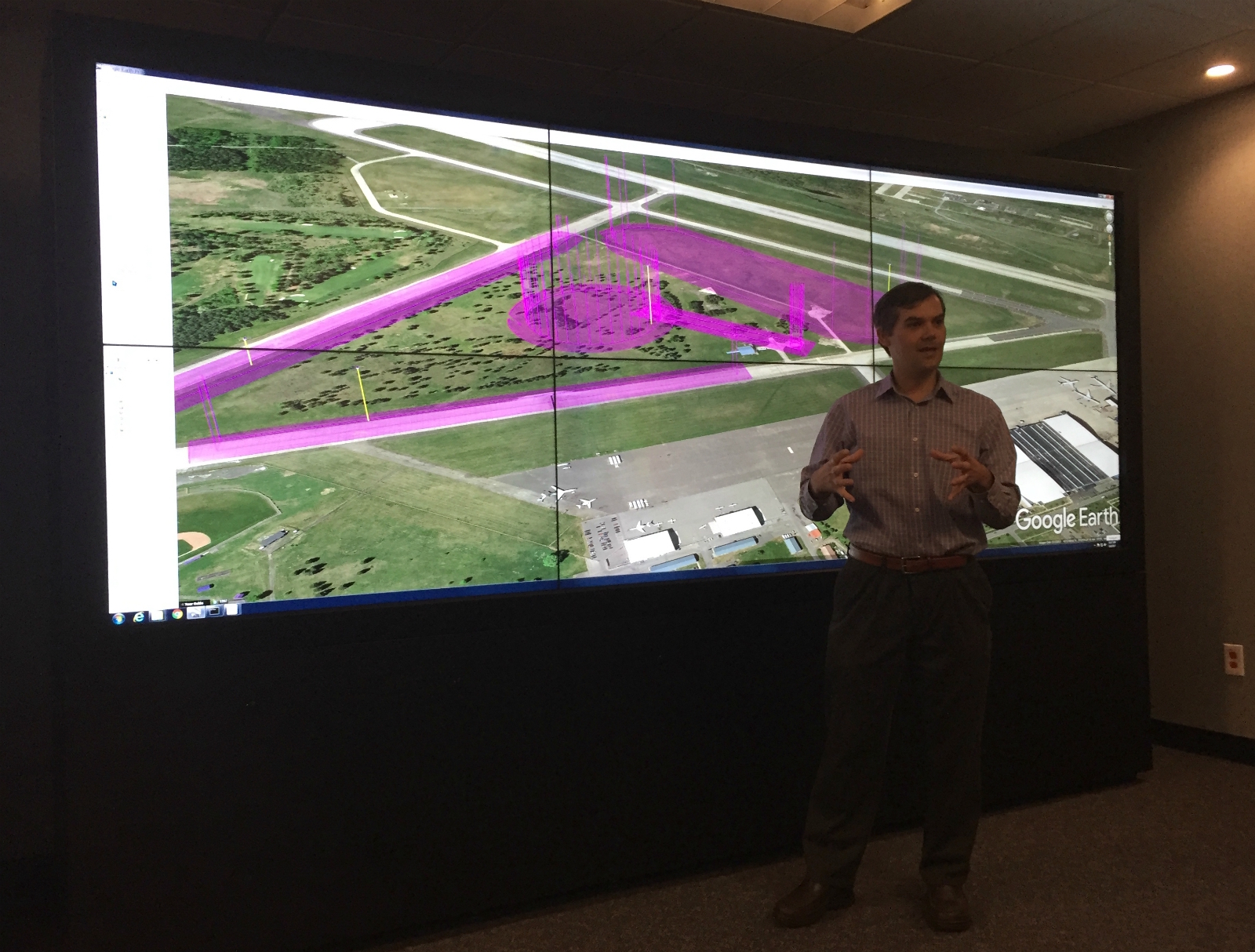 At NASA's Ames Research Center in Mountain View, Joey Rios, the drone traffic management project's technical lead, demonstrates how multiple drones flying close together can avoid colliding.