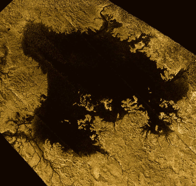 Ligiea Mare, one of Titan's large liquid methane seas. The image shows river-like drainage channels flowing into the sea. 