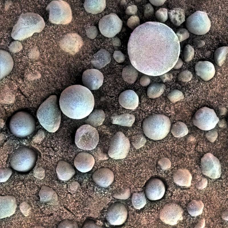 Grey hematite spherules, or "blueberries," imaged with Opportunity's microscopic camera instrument. 