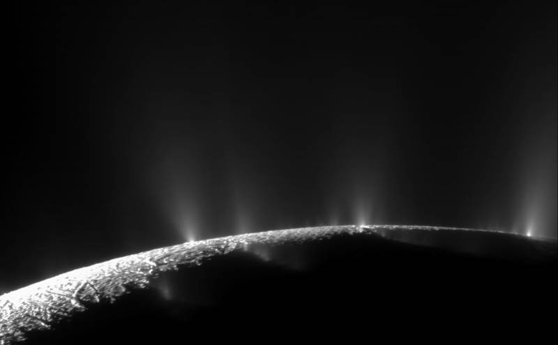 Plumes of water vapor erupting from the southern polar region of Enceladus. 