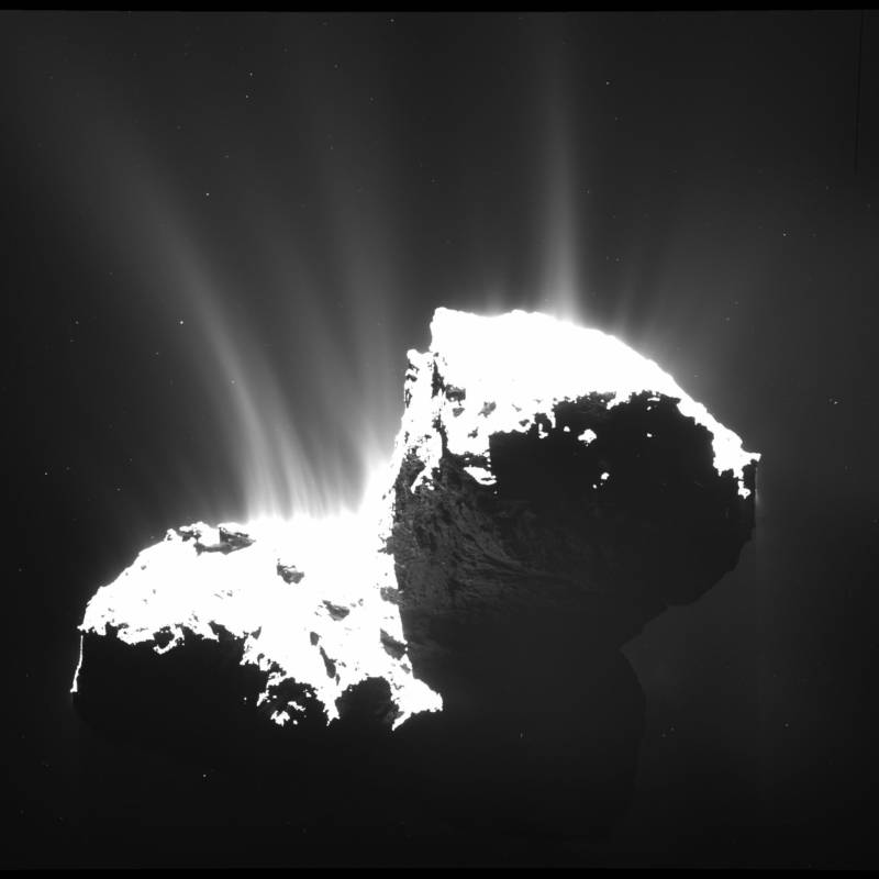 Comet 67P/Churyumov-Gerasimenko as seen by the European Rosetta spacecraft in 2014. The volatile ices contained in comets are vaporized by sunlight and out-gas into space to form the comet's tail.