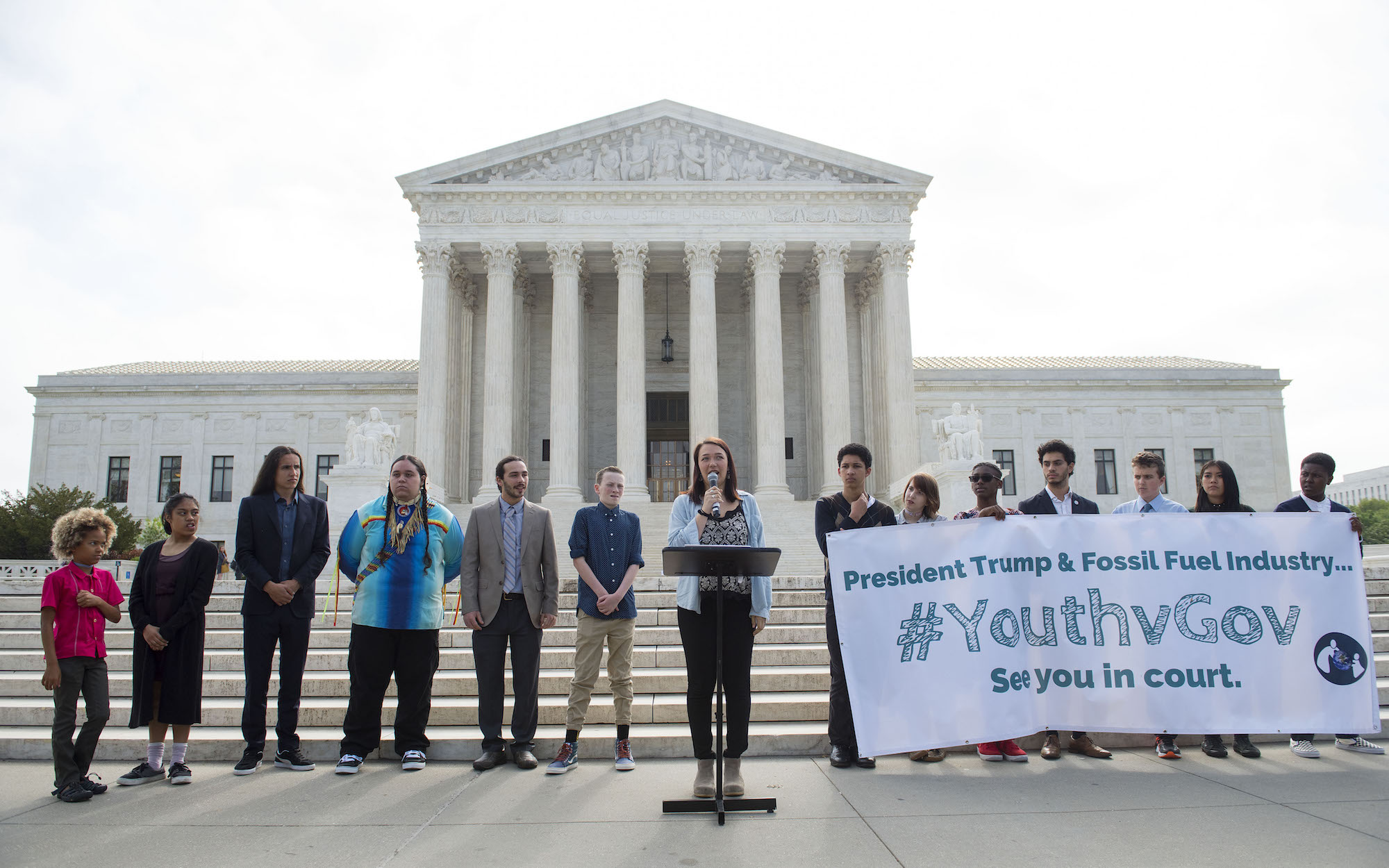 Youth plaintiff Kelsey Juliana speaks during a press conference in front of the U.S. Supreme Court in Washington, flanked by co-plaintiffs in their climate suit against the federal government.