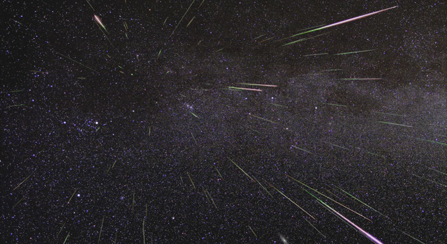Long exposure of night sky capturing meteors of the annual August Perseid shower. The meteors appear to radiate from a spot in the sky, called the "radiant". 