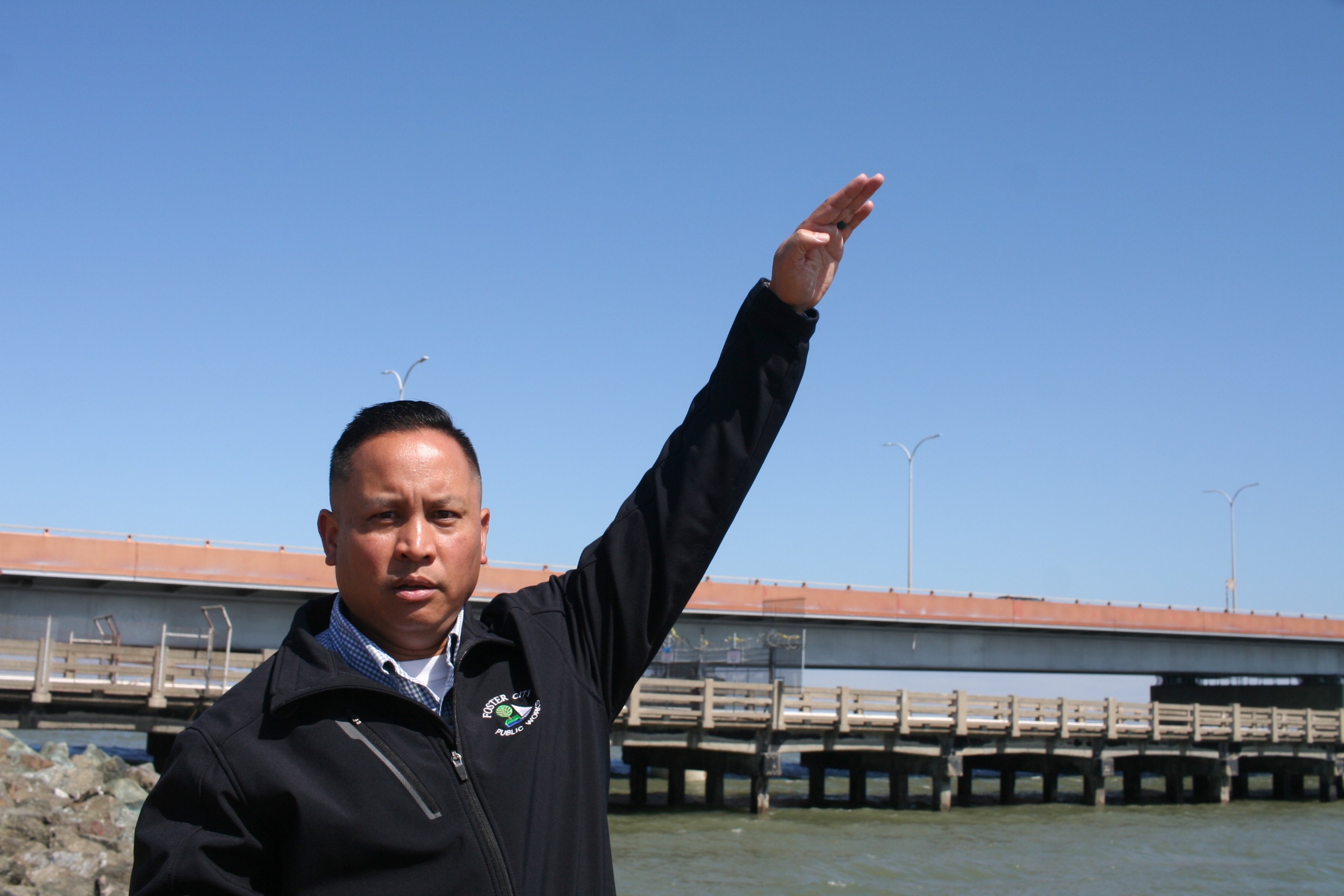 City Manager Jeff Moneda, standing on a levee.