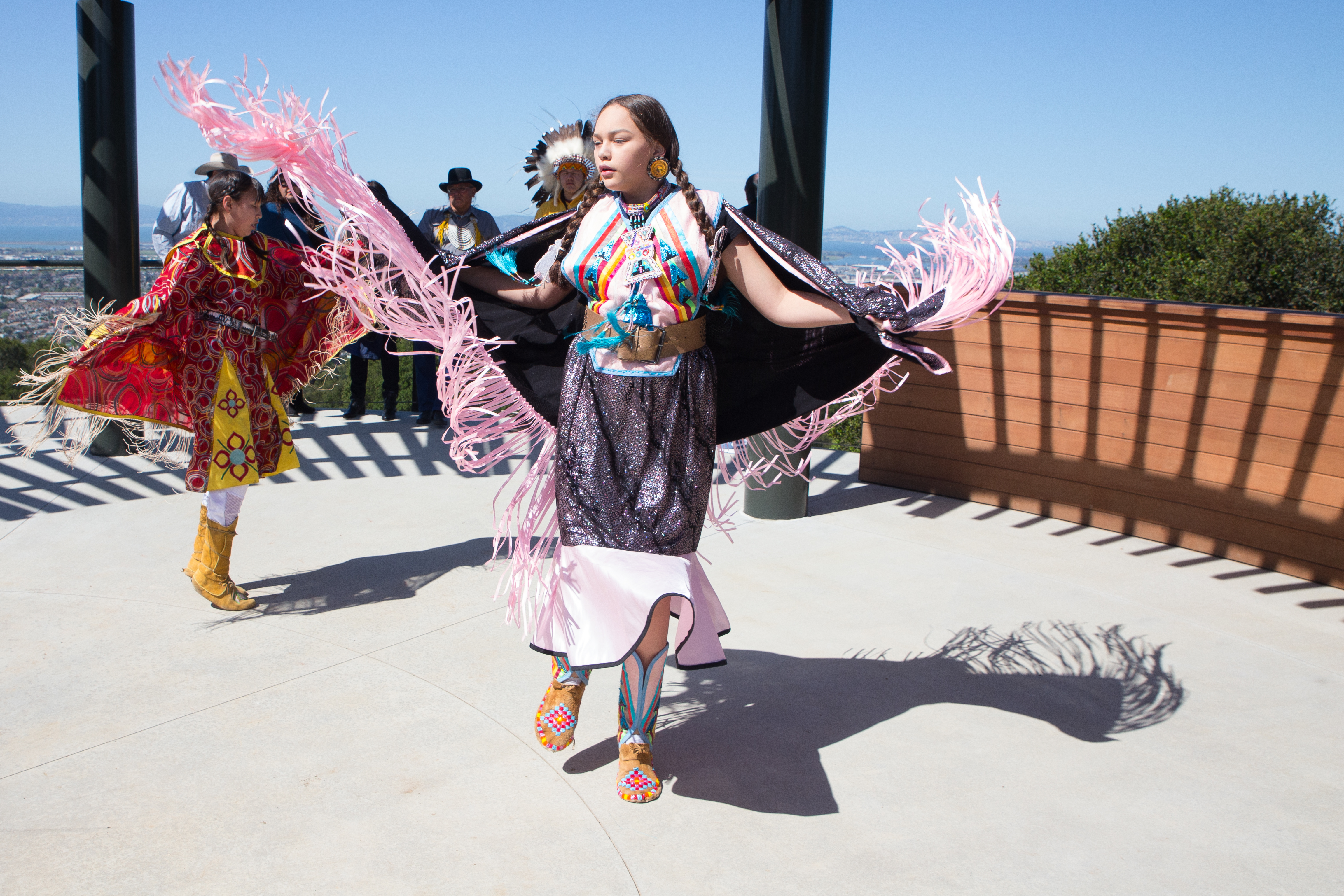 Jaklyn Mistaken Chief, 12, and Dallis Mistaken Chief, 9, from the Blood Tribe, dance the "Fancy Shawl" dance during a ceremony to welcome fourteen bison brought from the Blackfeet Nation in Montana.
