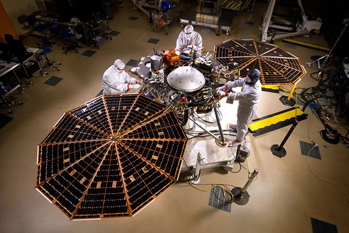 The InSIGHT lander during its assembly and testing phase. The circular solar panels (shown deployed in this picture) are designed to unfold like oragami fans after landing. 