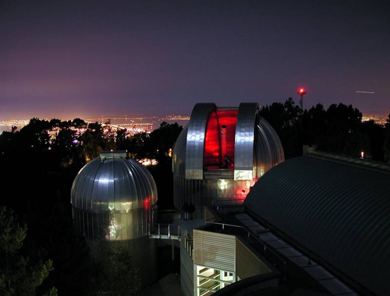 The glow of urban light pollution is an unfortunate backdrop for the observatory complex at Chabot Space & Science Center.