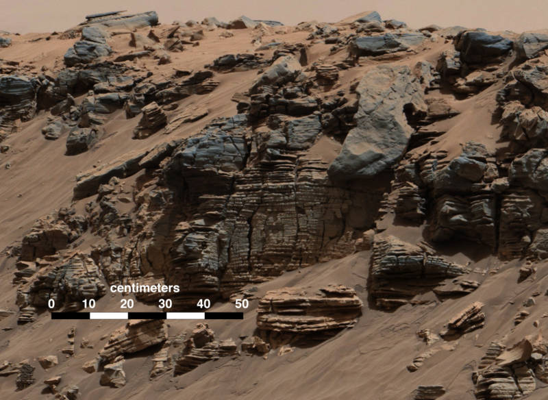 Fine sediment layers along Mount Sharp's lower slopes typical of lake bottom sediments deposited by the waters of river inflow. Picture taken in 2014 by the Curiosity rover.
