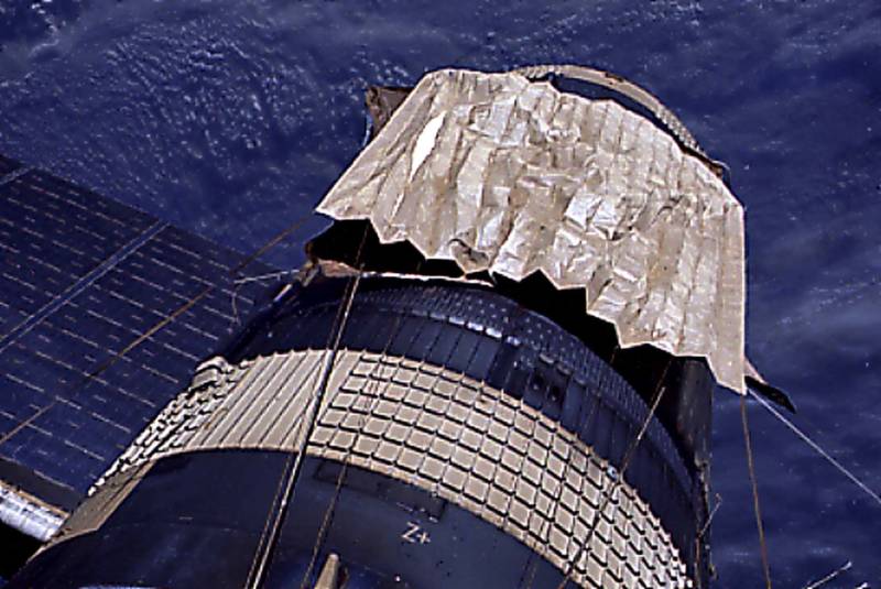A "space blanket" deployed to control solar heating of NASA's Skylab space station. The lightweight multi-layer foil material reflects almost 100% of the sunlight hitting it. 