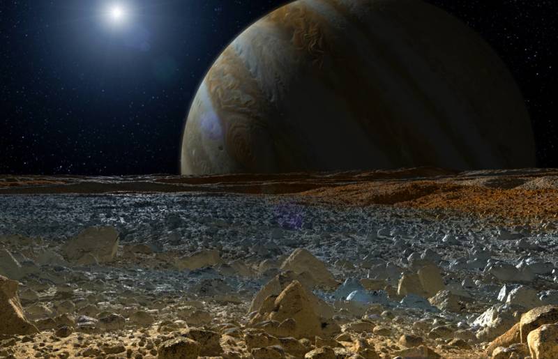 Artist concept of a view from Europa's icy surface, looking out upon Jupiter.
