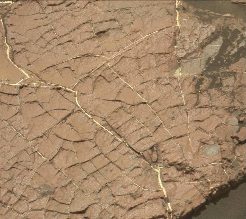 Cracks in the mudstone slab called "Old Soaker," whose formation dates back more than 3 billion years, may have formed in drying mud, as Mars experienced a global transition to a drying climate. 